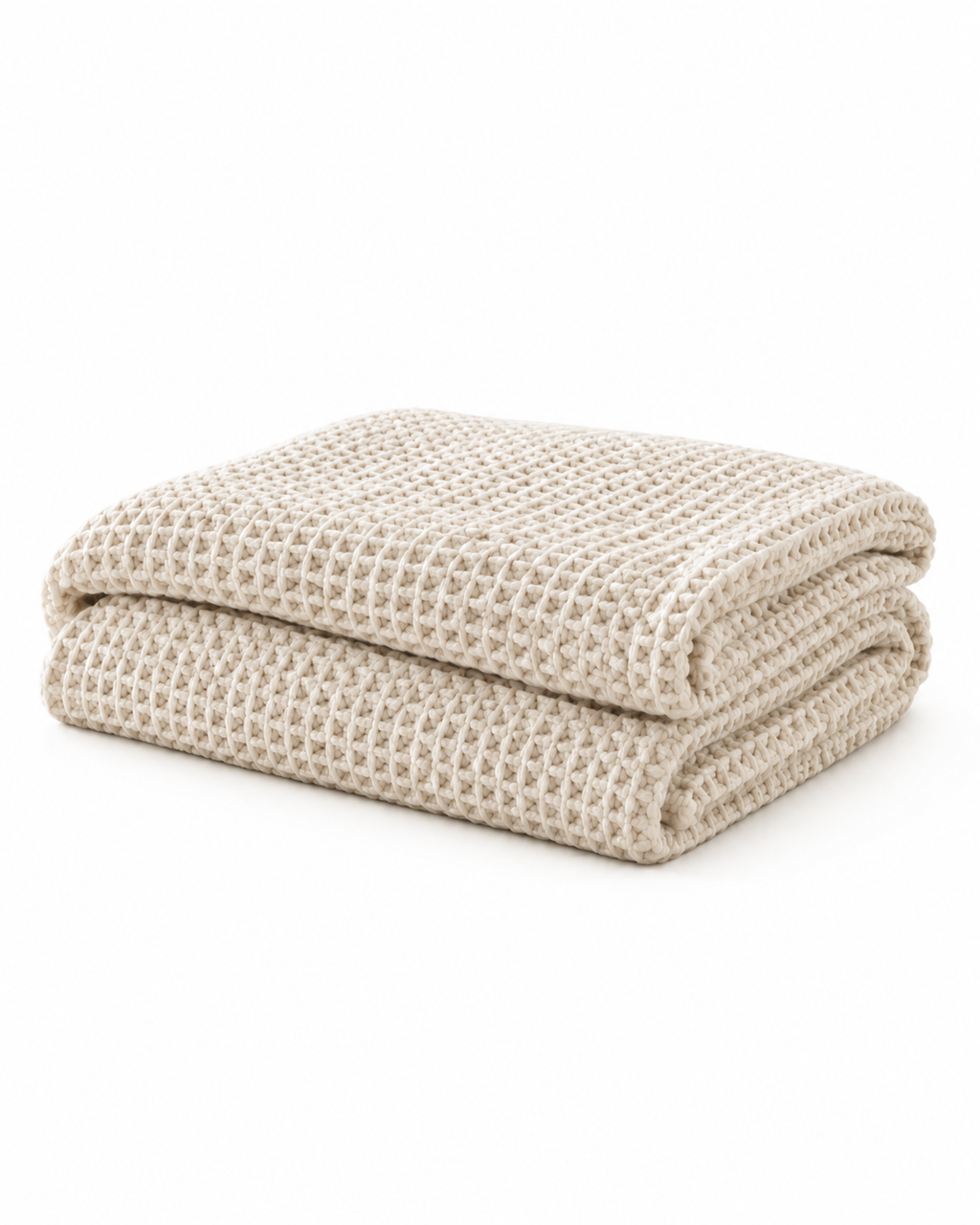 A folded rectangular woven throw blanket in a light beige color, featuring a textured basketweave pattern, shown flat against a white background.