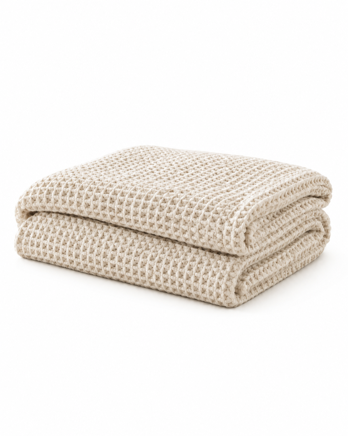 A folded rectangular woven throw blanket in a light beige color, featuring a textured basketweave pattern, shown flat against a white background.