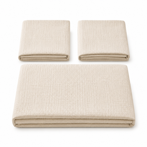 Three folded pieces of textured woven fabric in a light warm beige color, arranged on a clean white background.